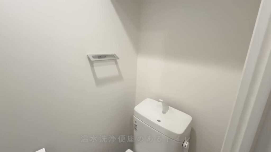プレシア高砂 1LDKのトイレの壁