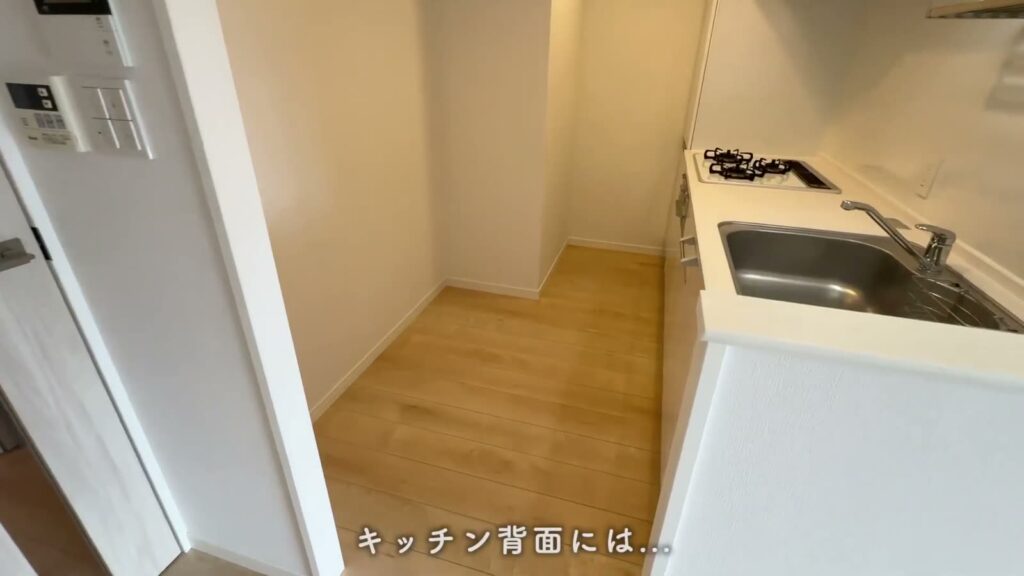 RJRプレシア千早 2LDKのキッチンの背面