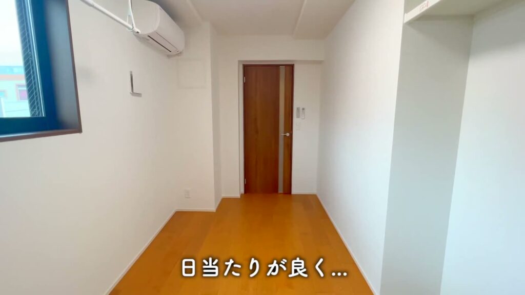 江東区石島 1LDKの洋室の入口